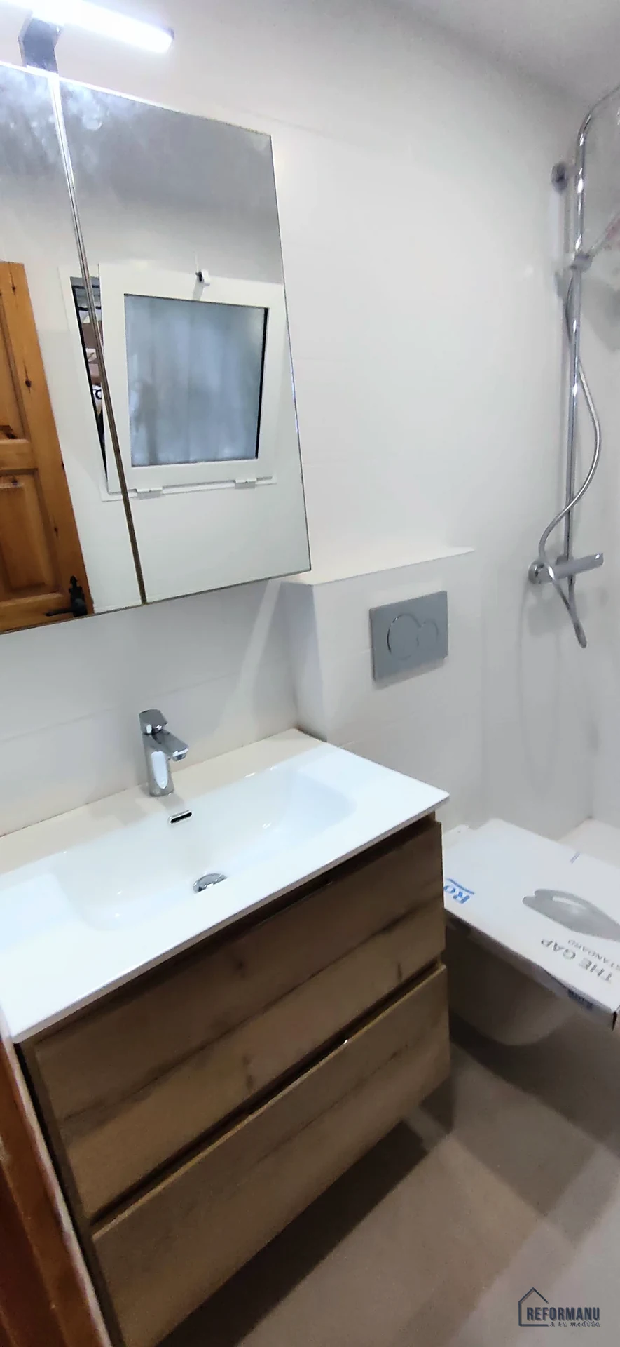 Oak bathroom with white tiling