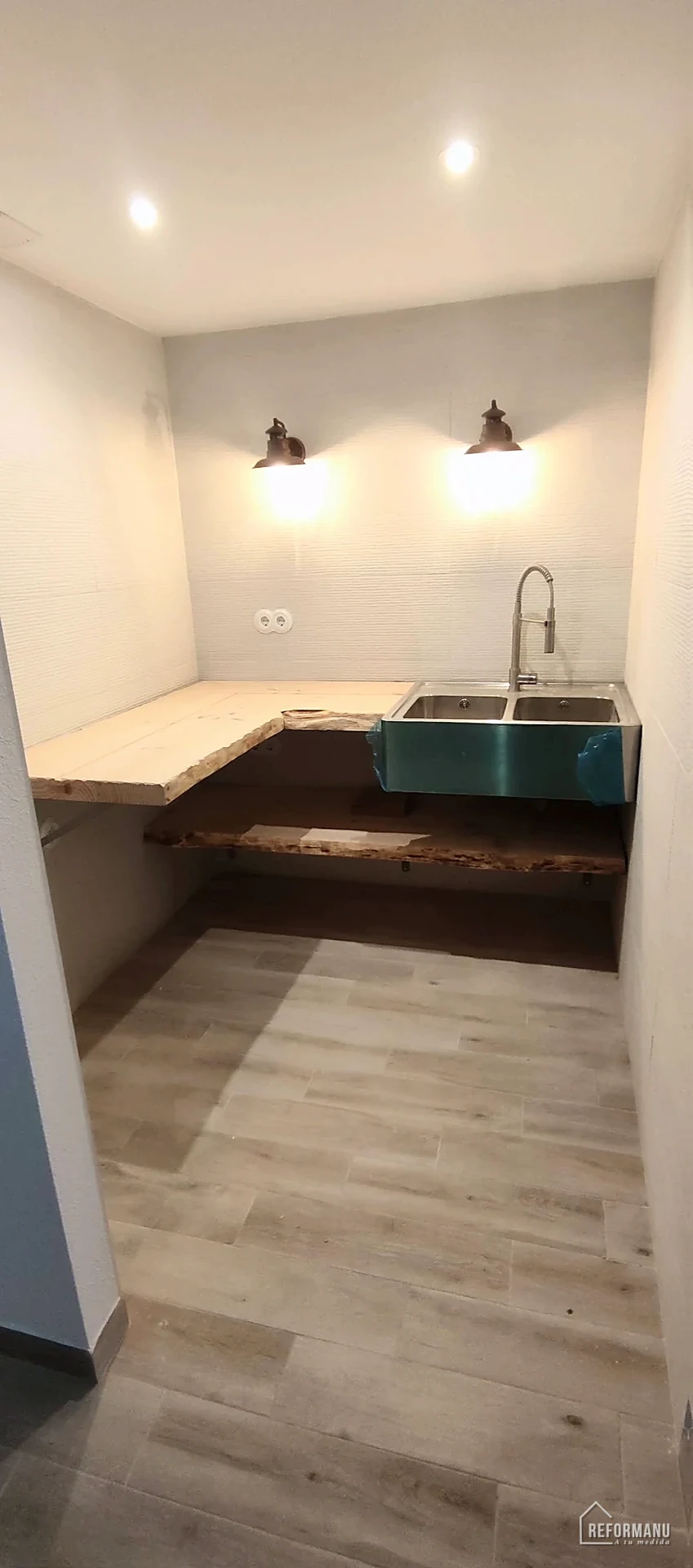 Utility kitchen with steel sink and wood worktop